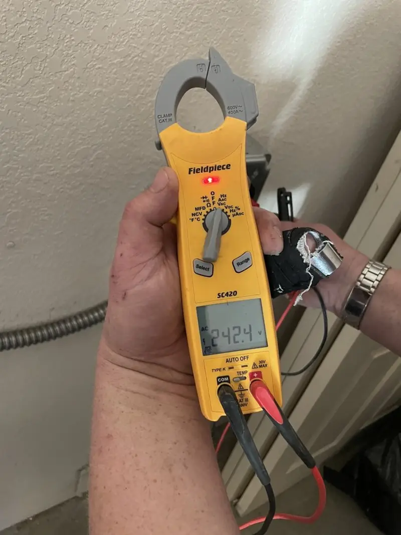 Voltage testing with clamp meter during Outlet Installation in Manila